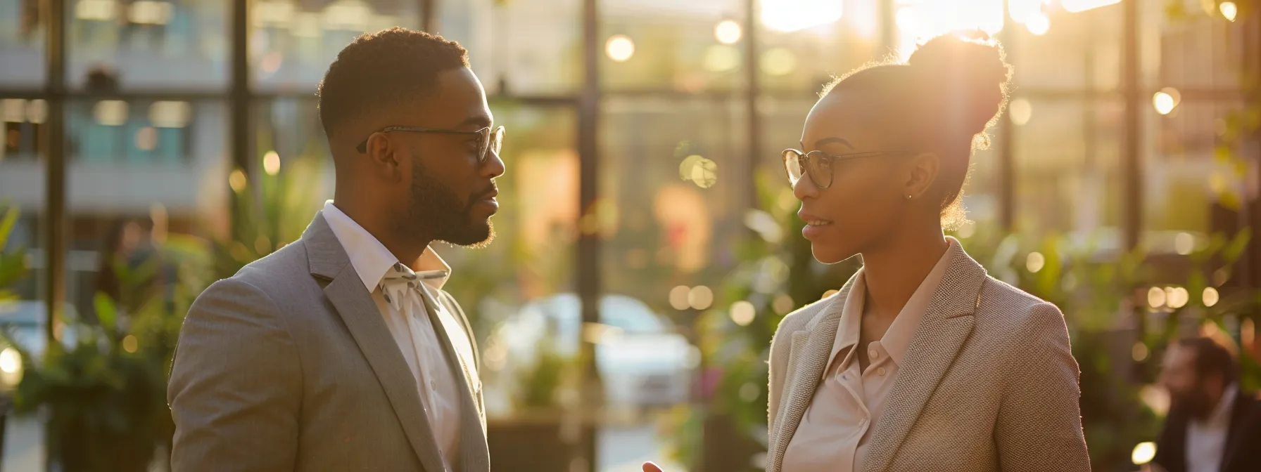 two business professionals are engaged in a focused discussion over wedding photography options.
