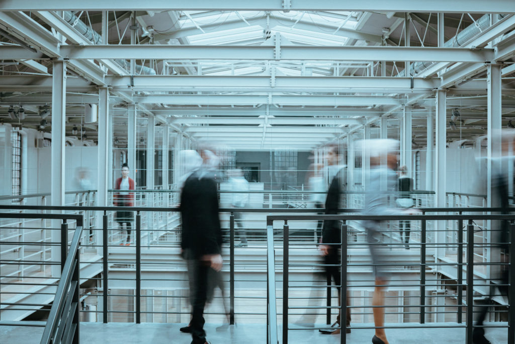 people standing in a large room