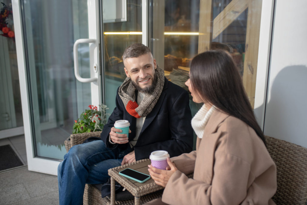 Pleasant young people talking to each other